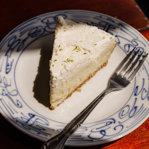 Slice of pie on a decorative plate with a fork