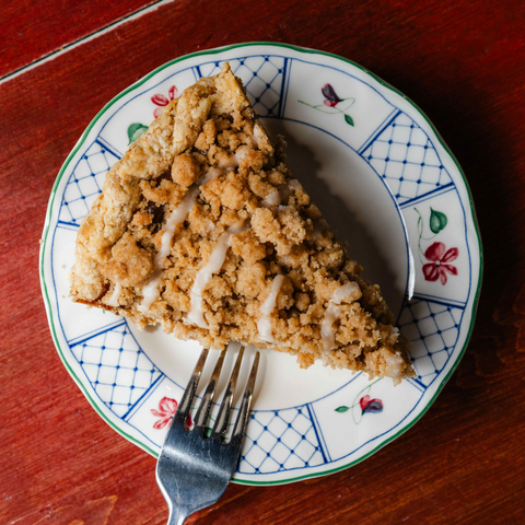 Slice of Pumpkin Crumble Pie on a plate with a fork