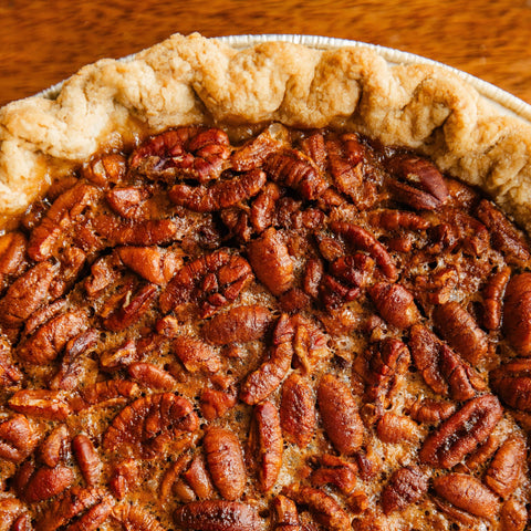 Close-up of a pecan pie with a golden crust