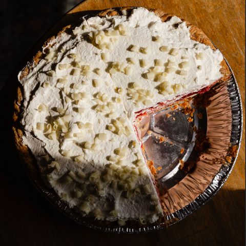 Pie with a slice removed, showing a decorative top crust