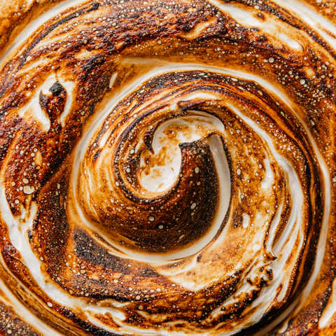Close-up of a swirled dessert with brown and white layers